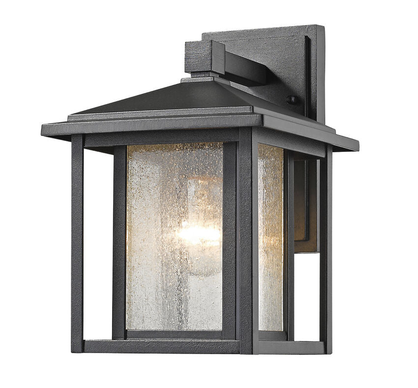 Z-Lite Aspen 9" 1-Light Black Aluminum Outdoor Wall Sconce With Clear Seedy Glass Shade