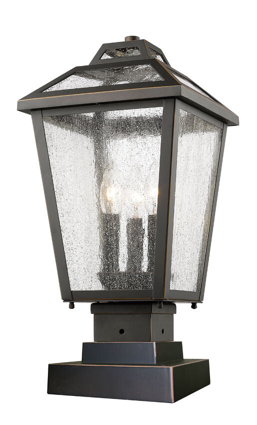 Z-Lite Bayland 9" W x 19" H 3-Light Oil Rubbed Bronze Outdoor Pier Mounted Fixture and Square Pier Mount Hardware With Clear Seedy Glass Shade