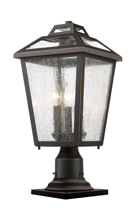 Z-Lite Bayland 9" W x 20" H 3-Light Oil Rubbed Bronze Outdoor Pier Mounted Fixture and Square Pier Mount Hardware With Clear Seedy Glass Shade