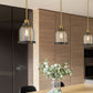 Z-Lite Burren 9" 1-Light Bronze and Brass Mini Pendant Light With Clear Seedy Glass Shade