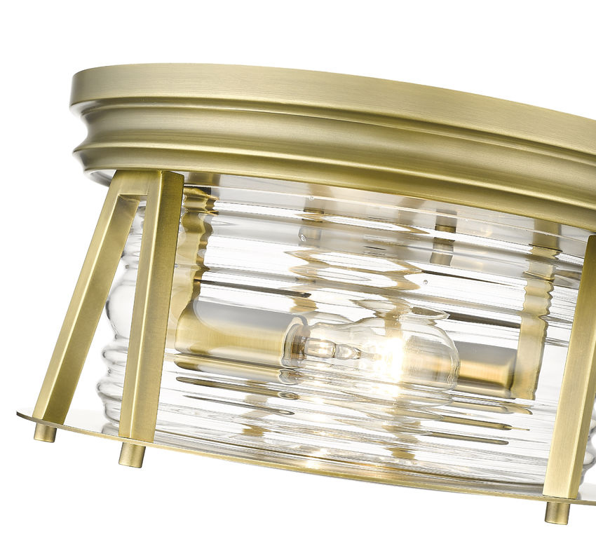 Z-Lite Cape Harbor 12" 2-Light Rubbed Brass Flush Mount Lighting With Clear Glass Shade