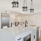 Z-Lite Cape Harbor 13" 1-Light Matte Black Steel and Water Hammered Glass Shade Pendant Light