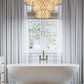 Z-Lite Dealey 26" 13-Light Heirloom Brass Pendant Light With Steel and Crystal Shade