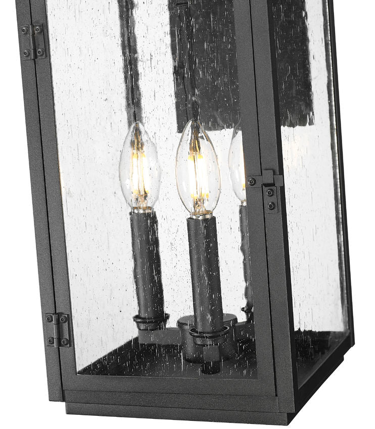 Z-Lite Hartwell 3-Light Candelabra Sand Black Aluminum Frame Clear Seedy Glass Shade Outdoor Wall Light