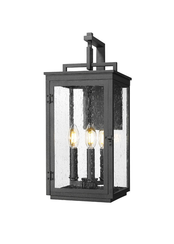 Z-Lite Hartwell 3-Light Candelabra Sand Black Aluminum Frame Clear Seedy Glass Shade Outdoor Wall Light