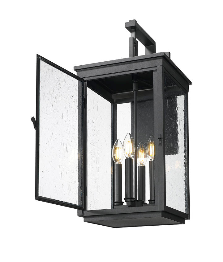 Z-Lite Hartwell 4-Light Candelabra Sand Black Aluminum Frame Clear Seedy Glass Shade Outdoor Wall Light