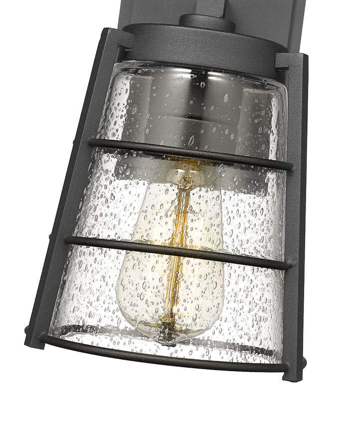 Z-Lite Helix 6" W x 9" H 1-Light Black Aluminum Outdoor Wall Sconce With Clear Seedy Glass Shade