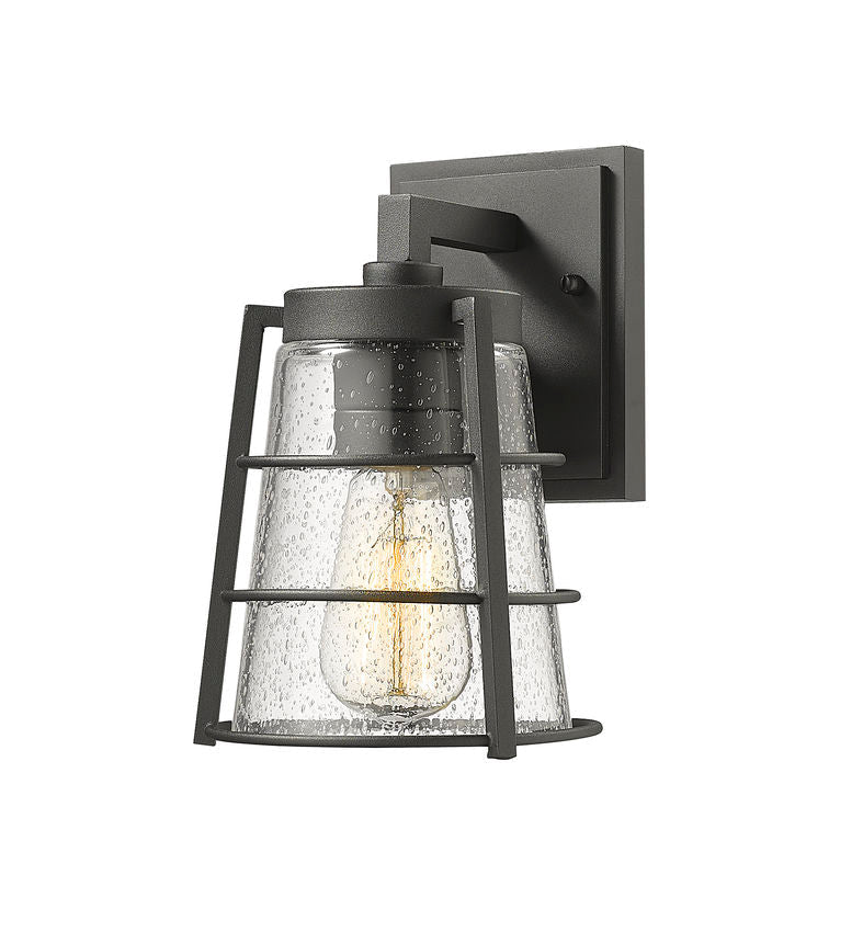 Z-Lite Helix 6" W x 9" H 1-Light Black Aluminum Outdoor Wall Sconce With Clear Seedy Glass Shade