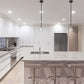 Z-Lite Kraken 6" 1-Light Matte Black and Brushed Nickel Mini Pendant Light With Clear Glass Shade
