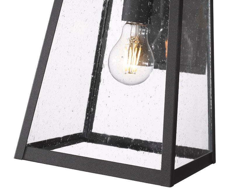 Z-Lite Rainer 10" 1-Light Black Aluminum Outdoor Wall Light With Clear Seedy Glass Shade