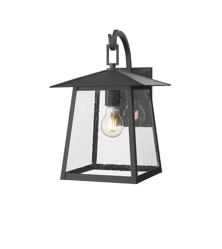 Z-Lite Rainer 10" 1-Light Black Aluminum Outdoor Wall Light With Clear Seedy Glass Shade