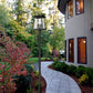 Z-Lite Rainer 5015PHXLR-5011P-BK 5-Light Black Aluminum Outdoor Post Mounted Fixture With Clear Seedy Glass Shade