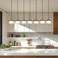 Z-Lite Renaud 7" 7-Light LED-Integrated Matte Black Steel Frame Feathered White Glass Shade Linear Chandelier