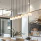 Z-Lite Renaud 7" 7-Light LED-Integrated Modern Gold Steel Frame Feathered White Glass Shade Linear Chandelier