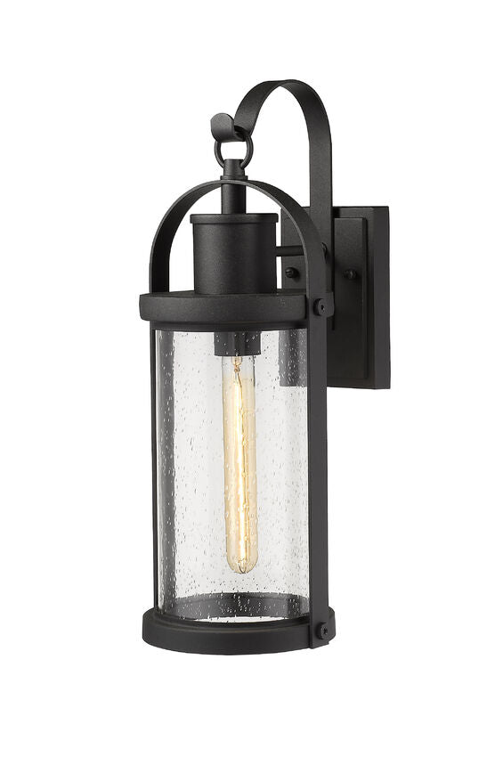 Z-Lite Roundhouse 8" 1-Light Black Outdoor Wall Sconce With Clear Seedy Glass Shade