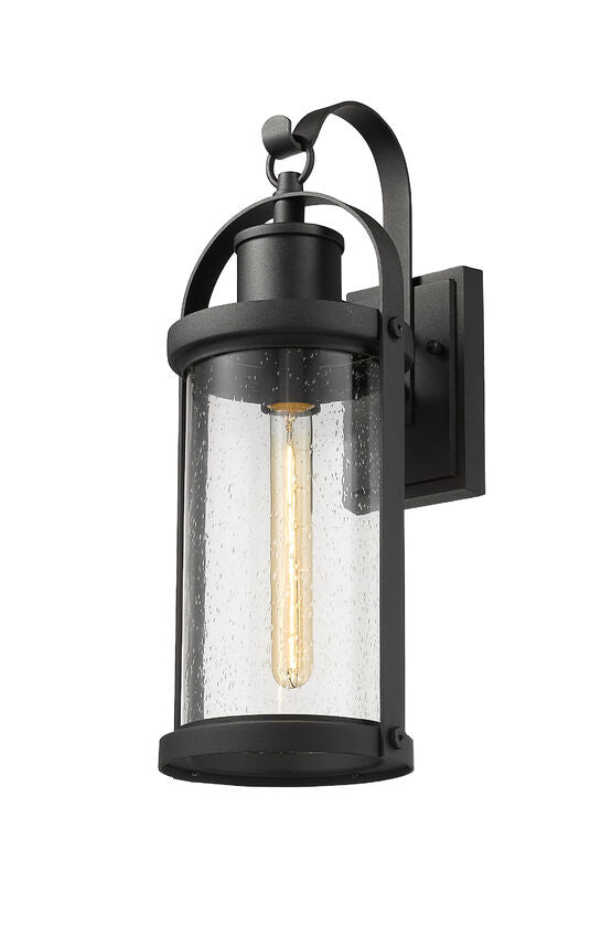 Z-Lite Roundhouse 8" 1-Light Black Outdoor Wall Sconce With Clear Seedy Glass Shade