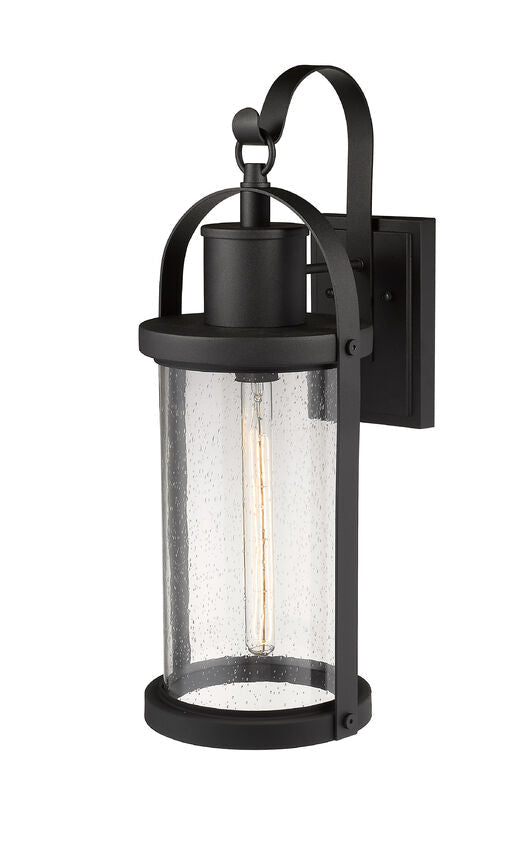 Z-Lite Roundhouse 9" 1-Light Black Outdoor Wall Sconce With Clear Seedy Glass Shade