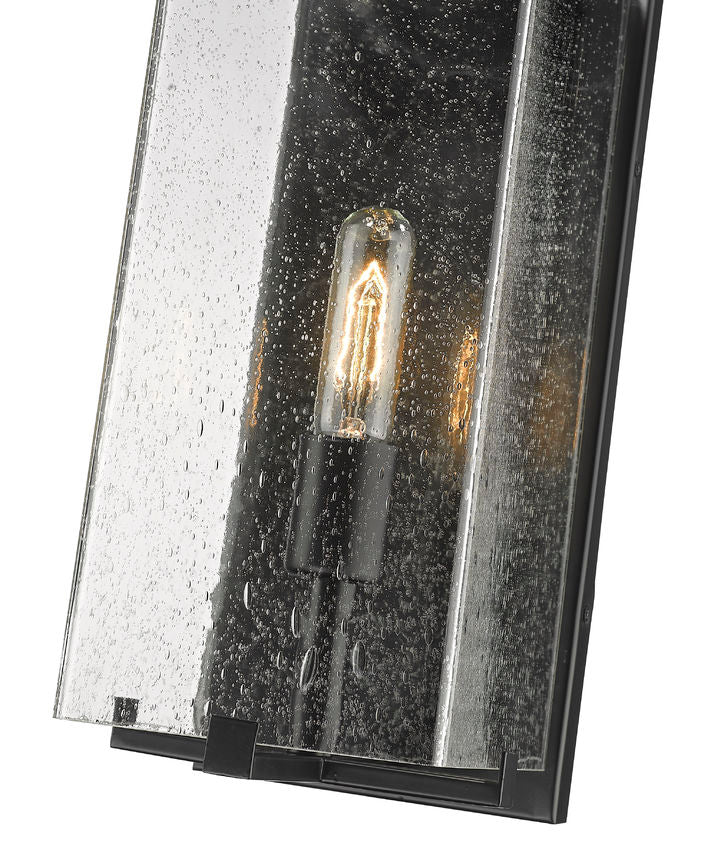 Z-Lite Sana 7" 1-Light Black Aluminum Outdoor Wall Sconce With Seedy Glass Shade