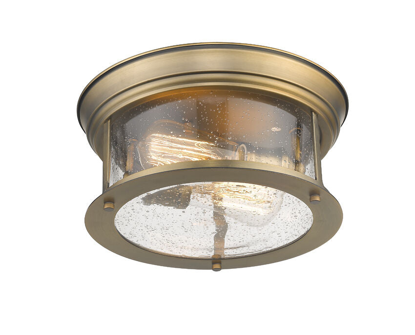 Z-Lite Sonna 11" 2-Light Heritage Brass Flush Mount Lighting With Clear Seedy Glass Shade