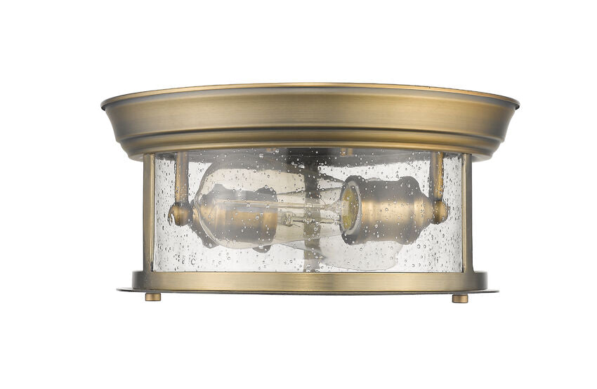 Z-Lite Sonna 11" 2-Light Heritage Brass Flush Mount Lighting With Clear Seedy Glass Shade