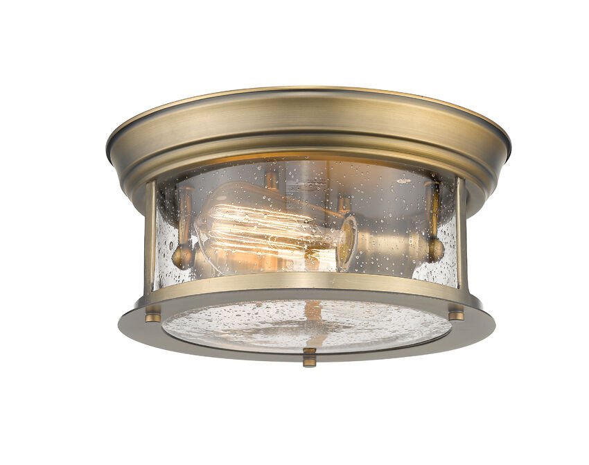 Z-Lite Sonna 11" 2-Light Heritage Brass Flush Mount Lighting With Clear Seedy Glass Shade