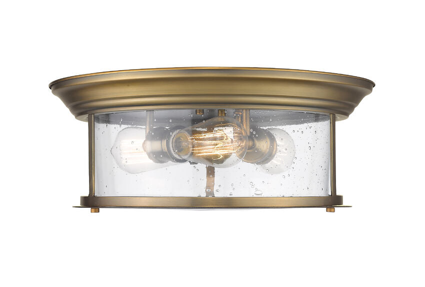 Z-Lite Sonna 16" 3-Light Heritage Brass Flush Mount Lighting With Clear Seedy Glass Shade