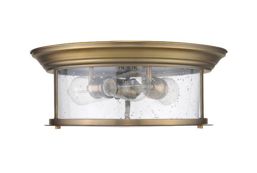 Z-Lite Sonna 16" 3-Light Heritage Brass Flush Mount Lighting With Clear Seedy Glass Shade