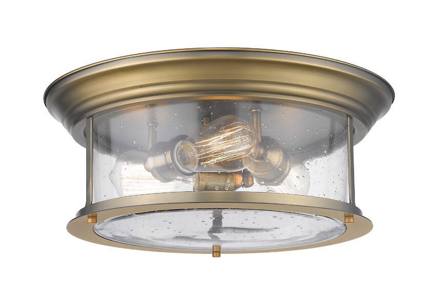 Z-Lite Sonna 16" 3-Light Heritage Brass Flush Mount Lighting With Clear Seedy Glass Shade