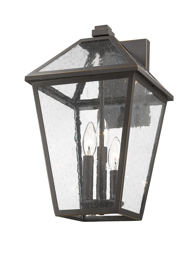Z-Lite Talbot 10" 3-Light Oil Rubbed Bronze Stainless Steel Outdoor Wall Sconce With Seedy Glass Shade