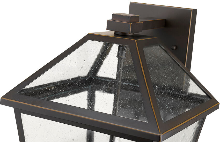 Z-Lite Talbot 10" 3-Light Oil Rubbed Bronze Stainless Steel Outdoor Wall Sconce With Seedy Glass Shade