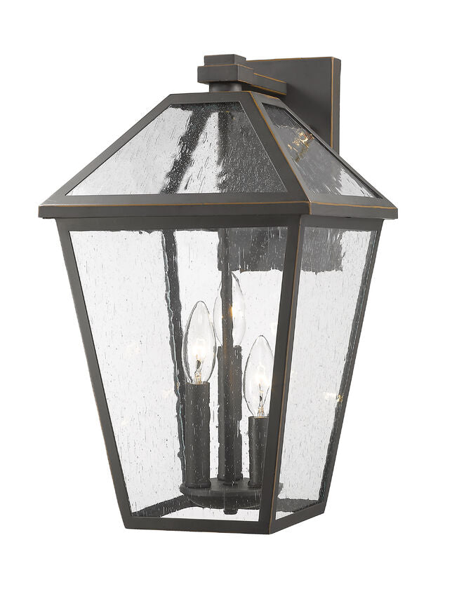 Z-Lite Talbot 10" 3-Light Oil Rubbed Bronze Stainless Steel Outdoor Wall Sconce With Seedy Glass Shade