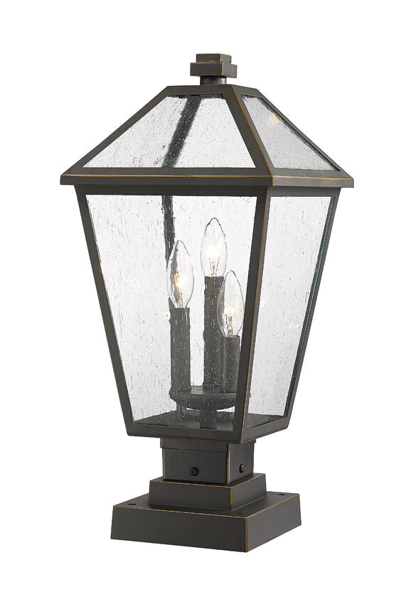 Z-Lite Talbot 10" W x 21" H 3-Light Oil Rubbed Bronze Outdoor Pier Mounted Fixture and Square Pier Mount Hardware With Seedy Glass Shade