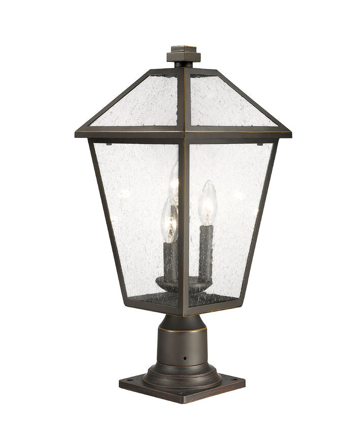 Z-Lite Talbot 10" W x 22" H 3-Light Oil Rubbed Bronze Outdoor Pier Mounted Fixture and Square Pier Mount Hardware With Seedy Glass Shade