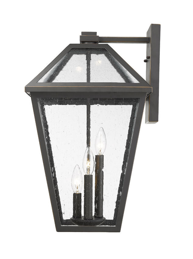 Z-Lite Talbot 12" 3-Light Oil Rubbed Bronze Stainless Steel Outdoor Wall Sconce With Seedy Glass Shade