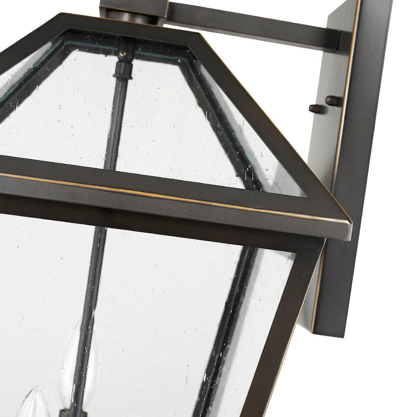 Z-Lite Talbot 12" 3-Light Oil Rubbed Bronze Stainless Steel Outdoor Wall Sconce With Seedy Glass Shade