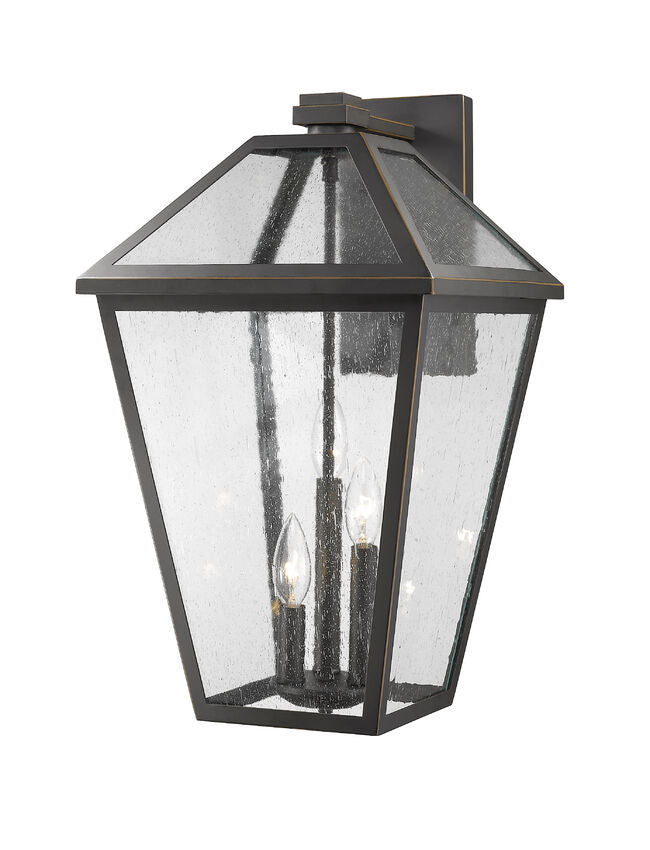 Z-Lite Talbot 12" 3-Light Oil Rubbed Bronze Stainless Steel Outdoor Wall Sconce With Seedy Glass Shade